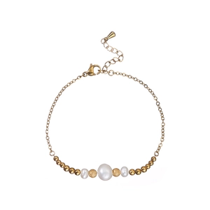Detail of freshwater pearl bracelet with gold beads and lobster clasp on white background