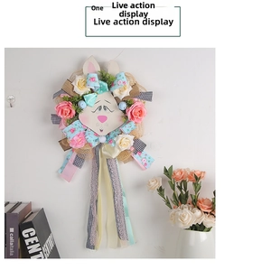 Close-up of Easter bunny wreath featuring floral roses and elegant lace ribbons