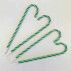 Set of four candy cane shaped ballpoint pens with festive green and white spiral stripes
