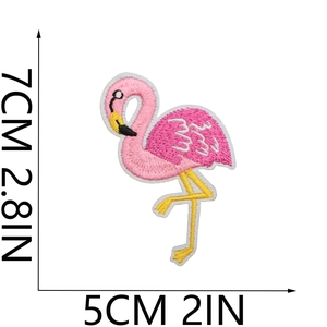 Detailed size view of the 7cm pink flamingo embroidery patch with fabric texture
