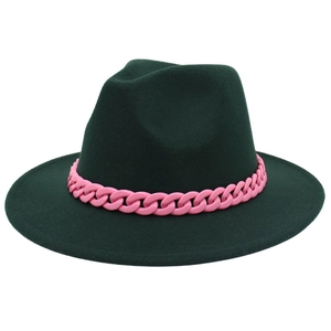 Detail of dark green wide brim fedora hat with decorative pink plastic chain