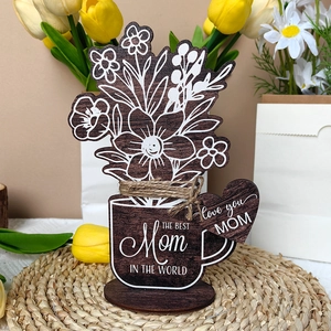 Detail of wooden flower pot ornament engraved with The Best Mom in the World text