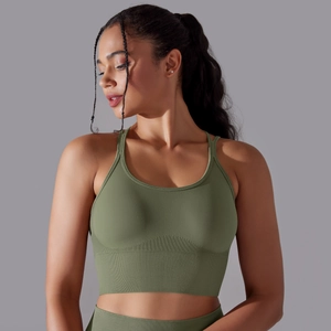 Detail of olive green seamless sports bra featuring ribbed hem and racerback design