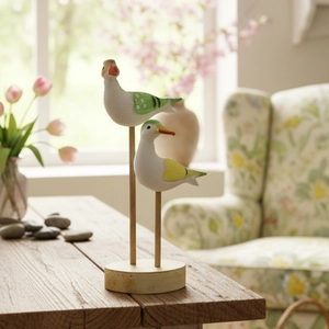 Modern minimalist hand-painted wooden seabird ornaments set on round wooden bases