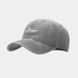 Close-up of grey washed cotton baseball cap with white Dragon calligraphy embroidery