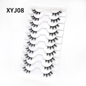 Close-up of 10 pairs of cat-eye false eyelashes XYJ08 on a white display tray