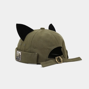 Detail view of army green beanie with cat ears, canvas texture and metal buckle