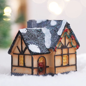 Luminous Christmas snow house resin model with warm festive lighting for indoor holiday decor