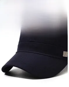 Detail of navy cotton flat cap with stiff brim and square silver metal logo accent