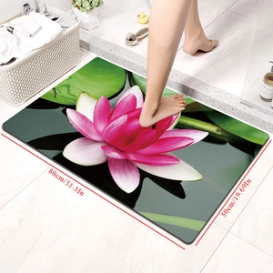 Detail view of 80x50cm absorbent bath mat featuring pink lotus and green leaves design