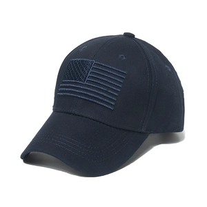 Close-up of navy blue baseball cap with tonal American flag embroidery detail