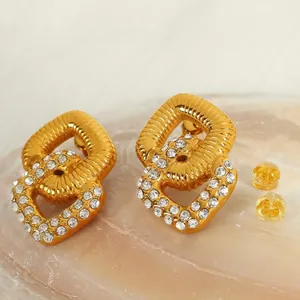 Fashionable gold double-layer geometric earrings with white rhinestones and silicone backs