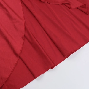 Detail of red evening dress showing elegant ruffles and tiered fabric texture
