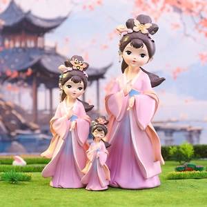 Three Chinese court ladies figurines in pink and blue robes for desktop decoration