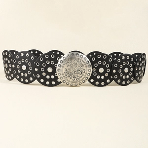 Detailed close-up of a western retro belt featuring floral embossed buckle and silver eyelets
