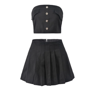 Detail of black tube top with silver buttons and matching pleated skirt set