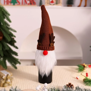 Detail of Christmas gnome wine bottle cover featuring brown knit hat with antlers