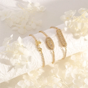 Adjustable gold bracelets with LOVE and AMOUR lettering inlaid with sparkling zircon stones
