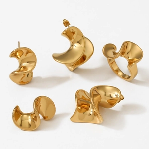 Minimalist gold 316L stainless steel jewelry set featuring irregular geometric ring and earrings