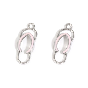 Detail view of pink enamel slipper charms with silver alloy frames for DIY jewelry making