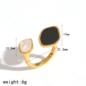 Detail view of gold open ring with black and white resin inlay and size measurements