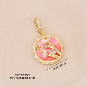 Detail view of pink and gold reindeer pendant with copper zircon inlay and pearl