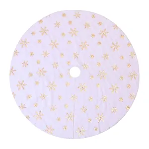 White plush Christmas tree skirt with golden sequin snowflakes for festive holiday decor