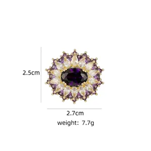 Floral brooch detail with purple gemstone and crystals, size 2.5cm by 2.7cm and 7.7g weight