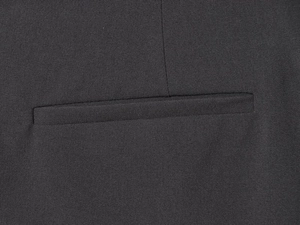 Close-up of premium black woven fabric featuring high-density sewing and a welt pocket