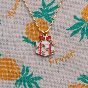 Gold-plated Christmas gift box pendant necklace with red enamel and zircon accents