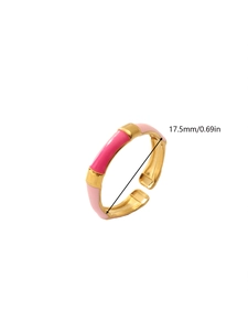 Detail view of 18k gold plated ring showing pink enamel pattern and 17.5mm diameter size