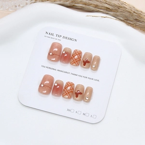 Handmade cat-eye press-on nails with plaid patterns, rhinestones and 3D bow designs