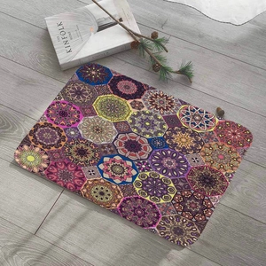 Colorful mandala pattern flannel floor mat with non-slip backing on grey wooden floor