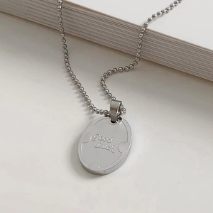 Minimalist silver stainless steel oval pendant necklace with Good Luck engraving on ball chain