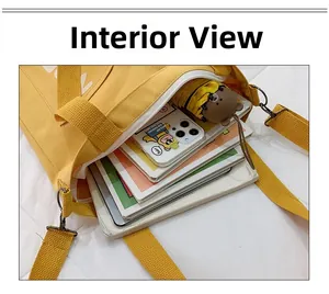 Internal view of yellow canvas tote showing storage space for tablet and books