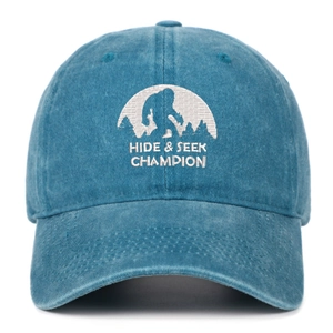 Detail of embroidered Bigfoot silhouette and Hide and Seek Champion text on cotton cap