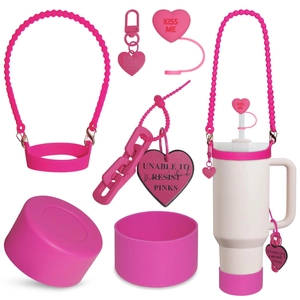 Pink heart-themed Stanley cup accessories set including silicone boot and straw cover
