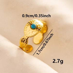 Hammered gold stainless steel open ring featuring a round blue gemstone centerpiece