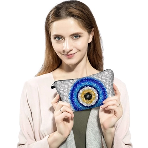 Handheld evil eye print cosmetic bag with mosaic pattern and black zipper closure