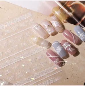 Detailed close-up of M-427 nail stickers featuring 3D embossed white lace and butterfly designs