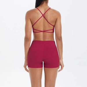 Détails de la brassière de yoga à dos croisé et short taille haute rose vif