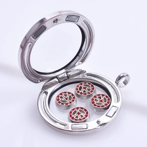 Silver glass locket pendant with red peace sign charms shown from a 45-degree angle