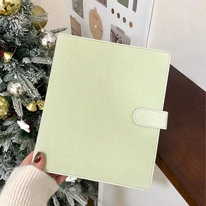 Close-up of light green PU leather loose-leaf binder cover with magnetic buckle closure