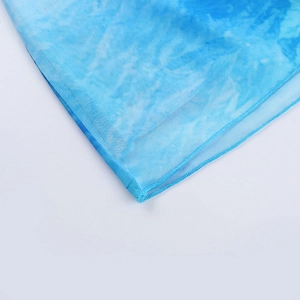 Detailed view of the blue and white tie-dye mesh fabric with fine stitching texture