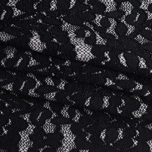 Gros plan sur un tissu en dentelle florale noire avec mesh détaillé et broderie