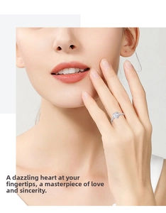 Close-up of heart-shaped moissanite ring in 925 silver with pavé-set diamonds