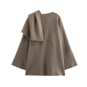 Detail of coffee brown knit sweater featuring an asymmetrical scarf neckline design