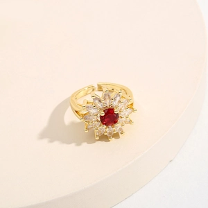 Adjustable gold sunflower ring with sparkling red and white cubic zirconia stones
