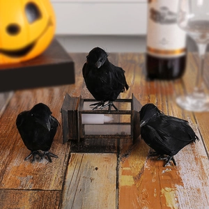 Realistic Halloween crow decorations with black feathers and a vintage wood lantern