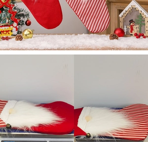 Red and striped Christmas gnome stockings with white faux fur trim and small bells